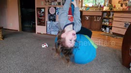 Toddler Swings Upside Down, Sticks Out Tongue