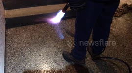 Saskatchewan man melts ice on path with blowtorch after freezing rain