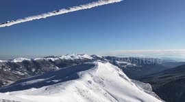 Beautiful winter panorama of a snowy mountains and ski tracks