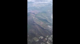 Earth relief with clouds from the airplane