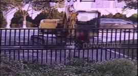 Schoolboy hijacks digger, knocks down iron gate