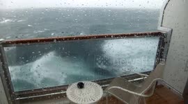 Queen Elizabeth in very rough sea.