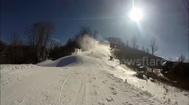 New Snowboarder falls and slides off the course