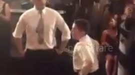 Father and son's epic dance battle at family wedding