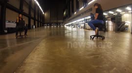 Riding office chairs through Tate Modern