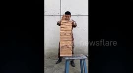 Chinese soldier 'breaks 14 bricks using his hand'