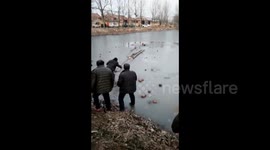 Villager saves boy who fell through ice on river