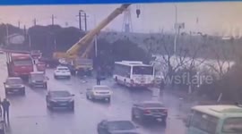 Crane driver rescues passengers trapped in sinking bus