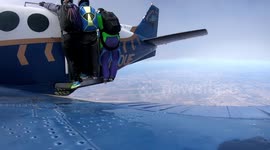 Skydivers parachute prematurely opens out the door of plane... lucky accident