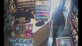 Hero shopkeeper swats away armed robber with wasp spray