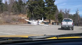 Light aircraft with four people on board crashes in California car park