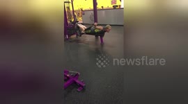 January gym enthusiast does front crawl on lat pulldown machine