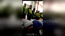 Chinese students bang their heads on floor in