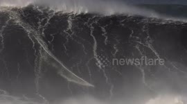 Big Wave Surfers ride the Biggest Swell in years off Nazaré, Portugal