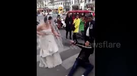 Angry bride drags groom in town with chain