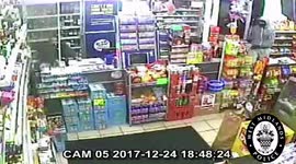This is the incredible moment a masked gunman met his match during a vicious robbery - when he was battered by a shopkeeper and his daughter