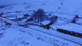 Drone Captures Jack Knifed Truck On Snowy Mountain Road