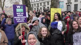 Marchers gather outside Downing St in London for