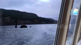 Chinese tourists in Scotland take pics of Nessie while on boat trip