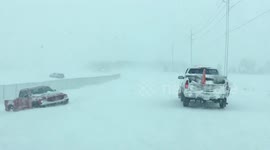 'It's like a car graveyard': Blizzard buries much of US MidWest