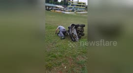 Hilarious moment worker falls off lawnmower