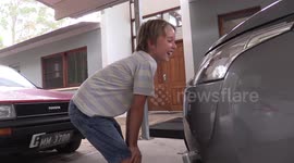 Dad pranks son with car headlamp water washers
