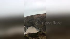 Newsflare Edit - Python found on cliffs in Portreath, Cornwall. Contains swearing. Completely unstaged.  Just a few guys going for a clifftop walk recording their walk.