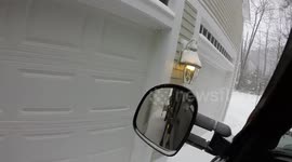 Cummins plowing along garages with Daniels pull plow