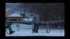 Skier hits hard a rail during stunt