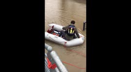 Flood in Paris - using a boat to work