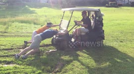 Hilarious moment golf cart gets stuck in mud in South Carolina