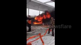 China bullet train bursts into flames at station