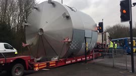 Huge brewing drum gets stuck at traffic light