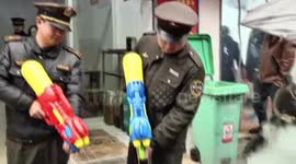 Chinese police squirt water pistols at illegal coal stoves