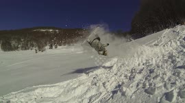 Guy on snowboard faceplants after backflip attempt