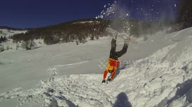 Male snowboarder FACEPLANT during stunt