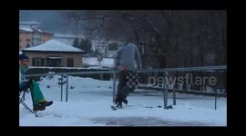 Skier lands VERY painfully during jump and slide stunt