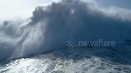Spectacular drone footage captures giant-wave surfer's wipeout near miss