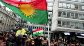 Police ask to remove a banned PKK flag from protester at demonstration outside BBC