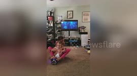 Funny moment sisters crash hoverboard into TV