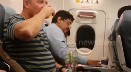 Plane Rage! Peter Rosenfeld films a passenger losing it.