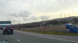 Car suddenly goes off the road, takes out road sign and porta potty