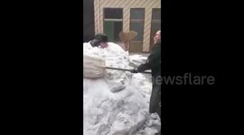 Woman buries husband in snow to punish him