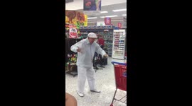 Elderly man shows off his dancing skills in supermarket