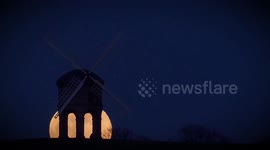Awe-inspiring footage shows the incredibly rare Super Blue Blood Moon rising over an historic windmill in front of stunned stargazers