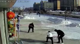 Good samaritans help man to pick up bank notes which blew away