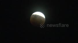 Seeing the process of the Super blue blood moon from tourist spot in Indonesia