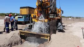 Water gushes from Cape Town borehole ahead of Day Zero