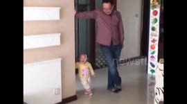 Cute toddler mimics dad's posture