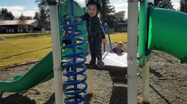 Kid jumping hits playground toy and falls